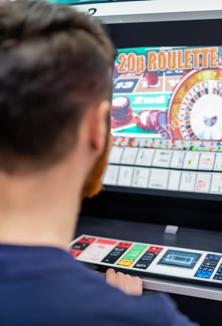 A man at a betting terminal