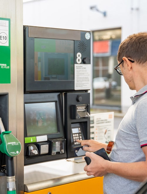 Man at a gas pump station