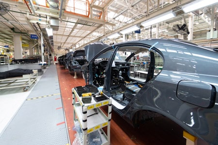 An automotive manufacturing plant that uses linerless label printers