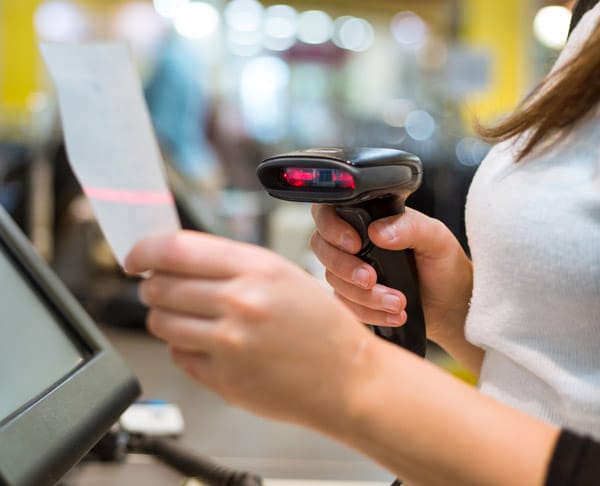 Sales associate scanning a receipt at the counter