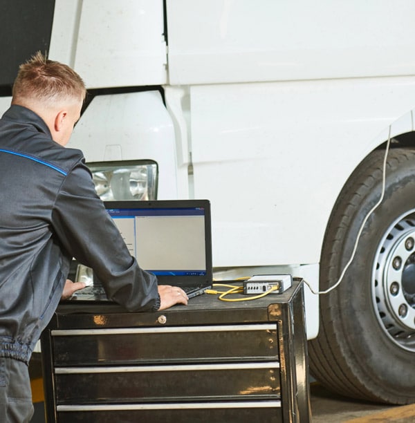 Mechanic perofrming a truck diagnostic